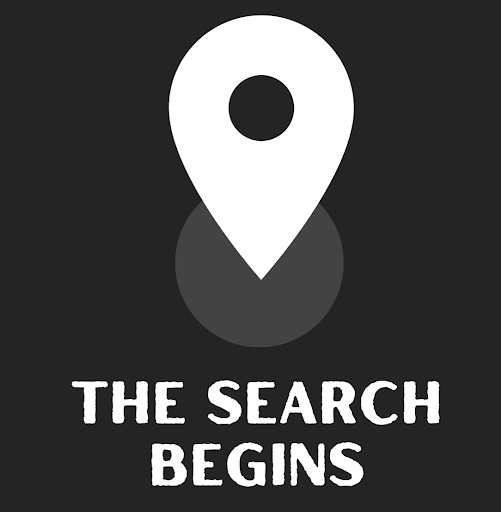 Image of a map pin that had the text 'The Search Begins' underneath